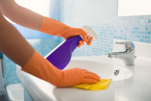 Deep cleaning a living room sofa in a Merton property