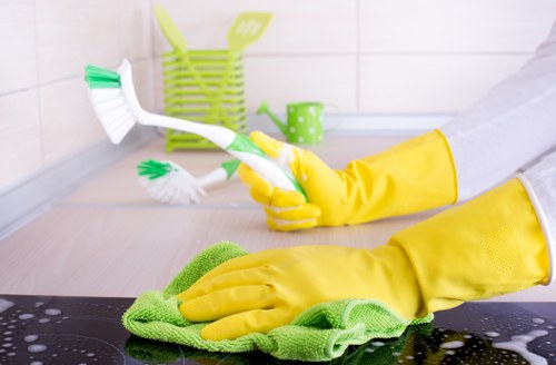 Cleaning desks, floors, and shared office areas in a Merton workplace