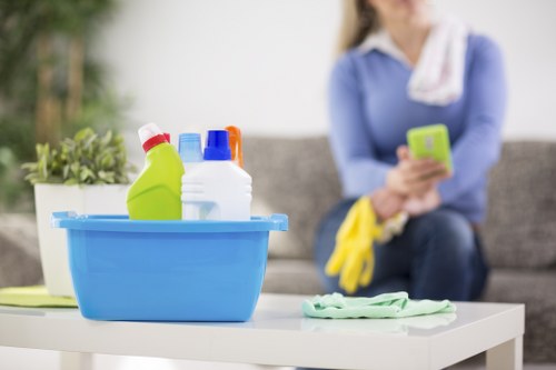 Local technician treating a stubborn stain on a sofa or armchair